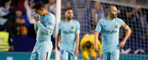 Barcelona's Philippe Coutinho with former teammate Andres Iniesta