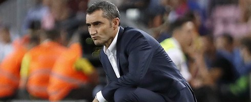 Barcelona boss Ernesto Valverde crouching