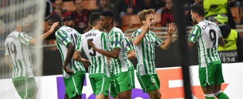 Real Betis celebrate scoring in Milan