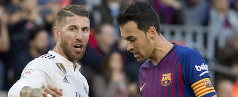 Real Madrid's Sergio Ramos with Sergio Busquets of Barcelona