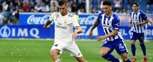 Real Madrid's Dani Ceballos vies with Burgui of Alaves