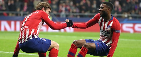 Atletico Madrid's Antoine Griezmann celebrates with Thomas Lemar