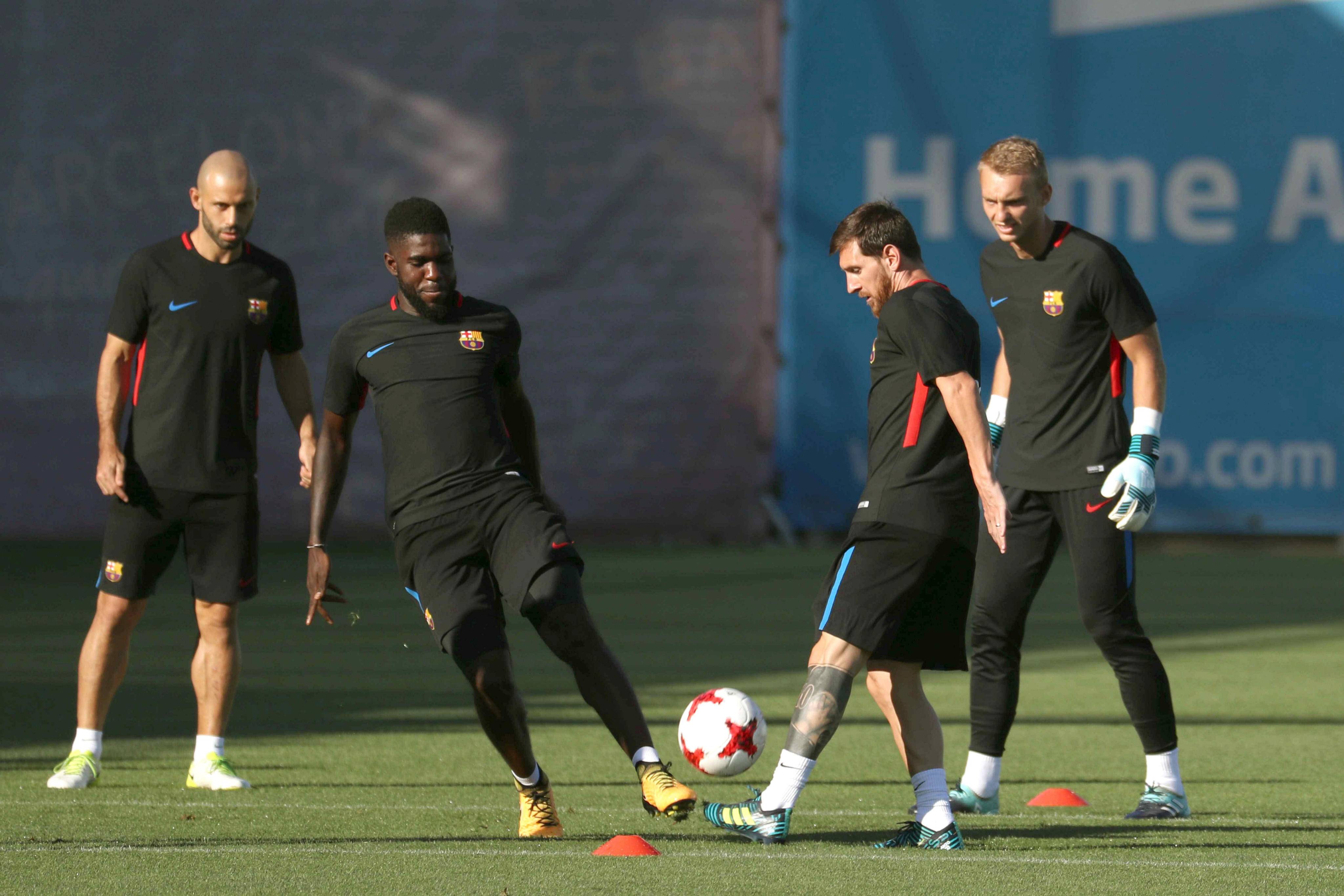 Samuel Umtiti and Lionel Messi