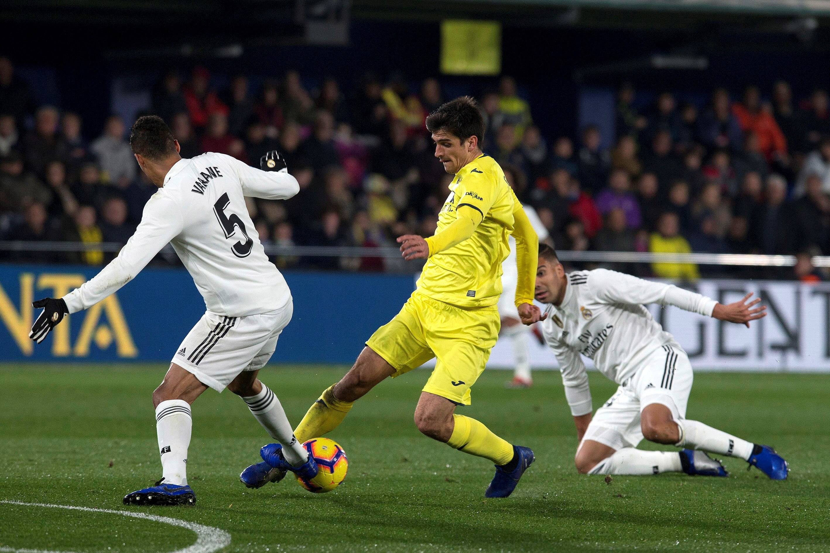 Raphael Varane marks Gerard Moreno