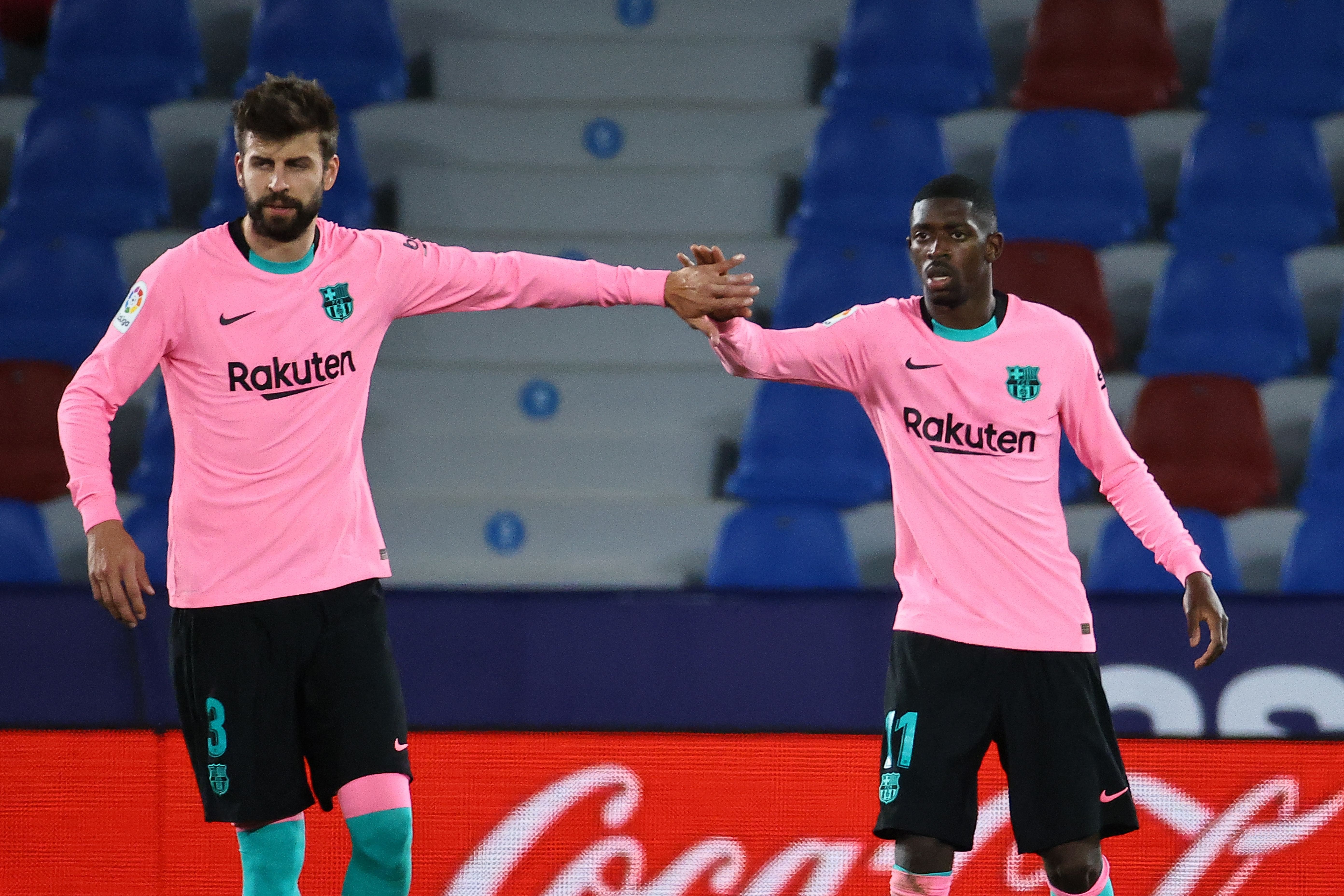 Gerard Pique and Ousmane Dembélé of FC Barelona