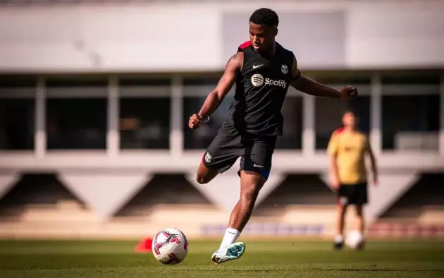 Ansu Fati strikes the ball in training.