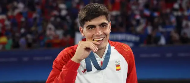 Juanlu collects his gold medal at the Olympics.
