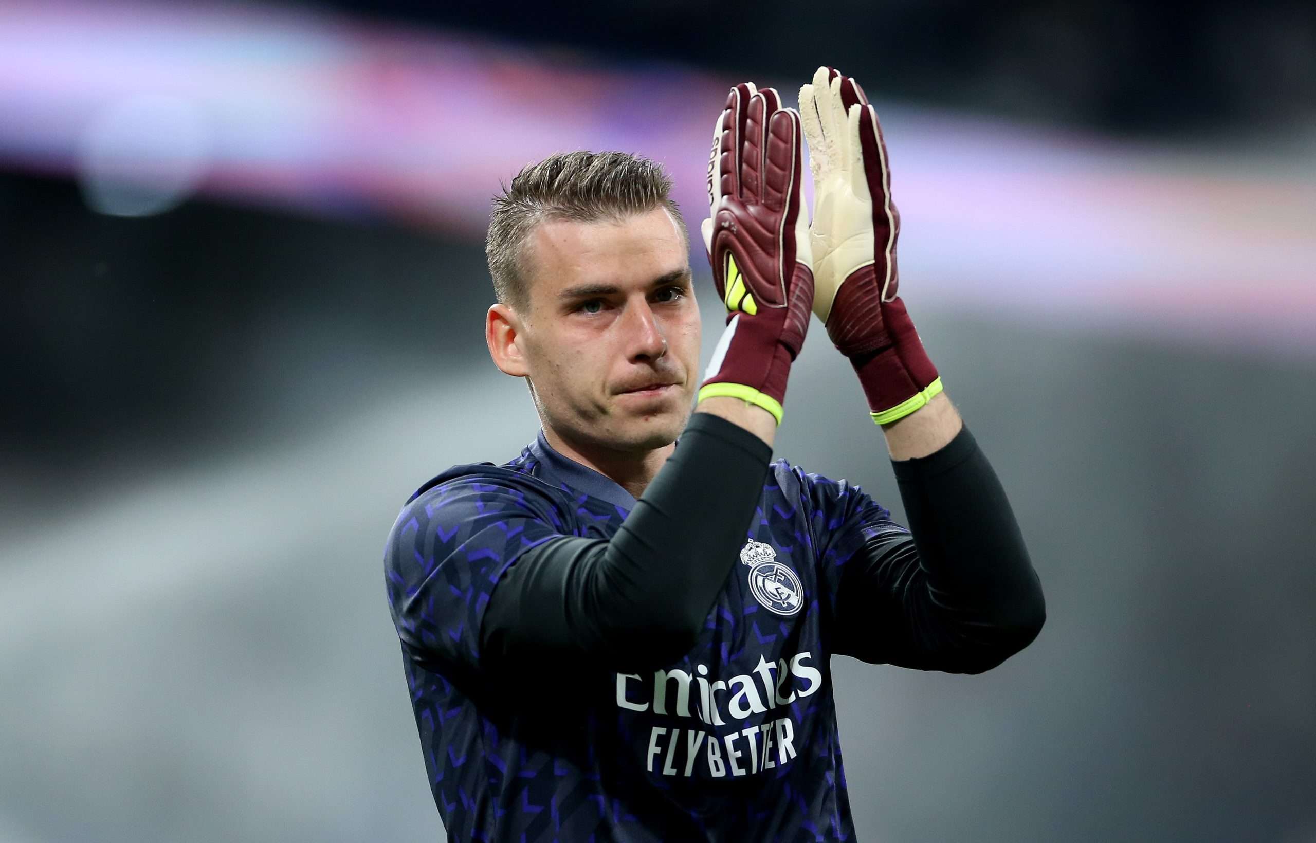 Andriy Lunin applauds the crowd.