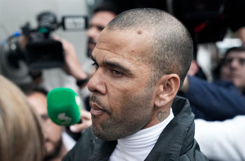 Dani Alves leaves court.