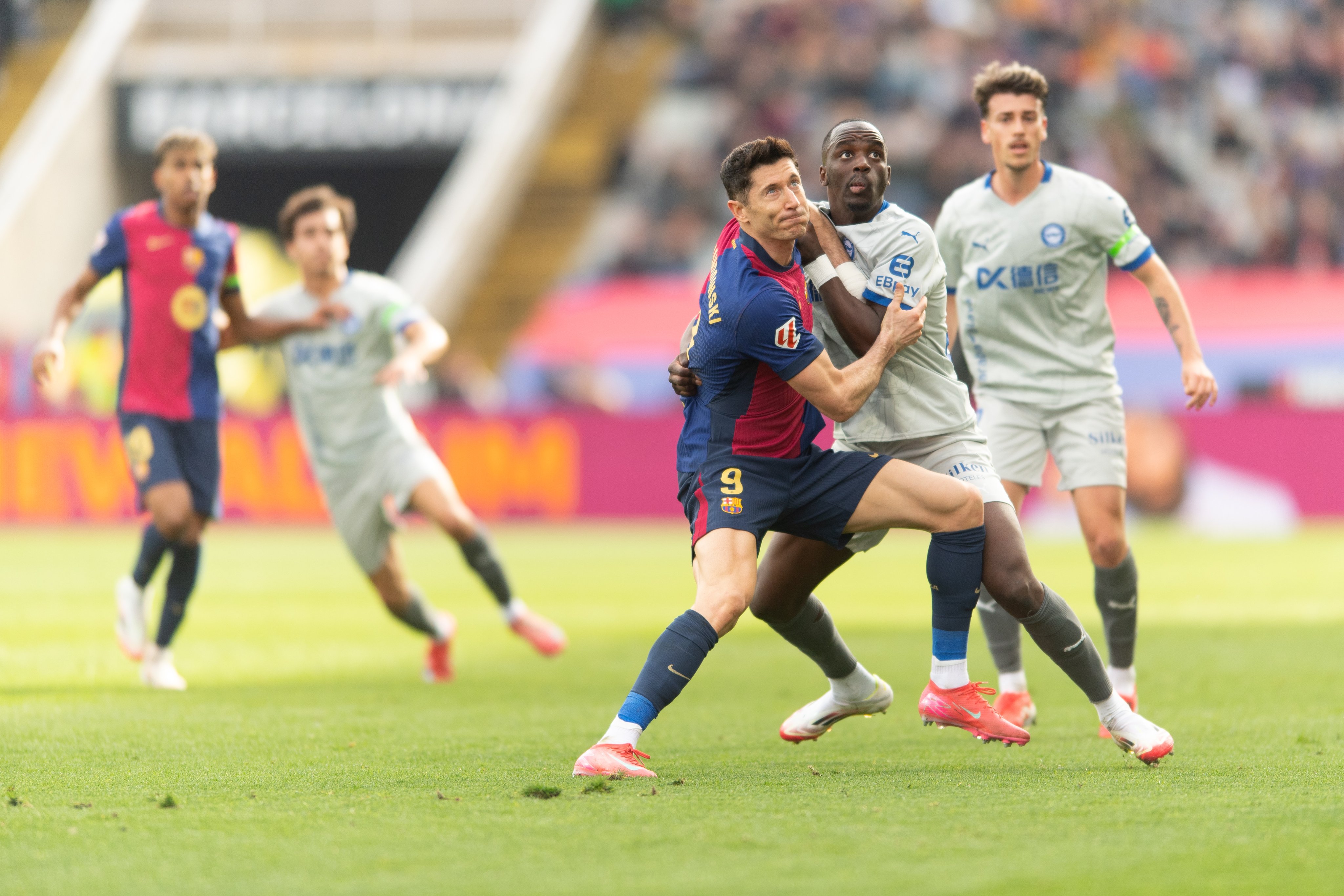 Lewandowski battles for the ball.