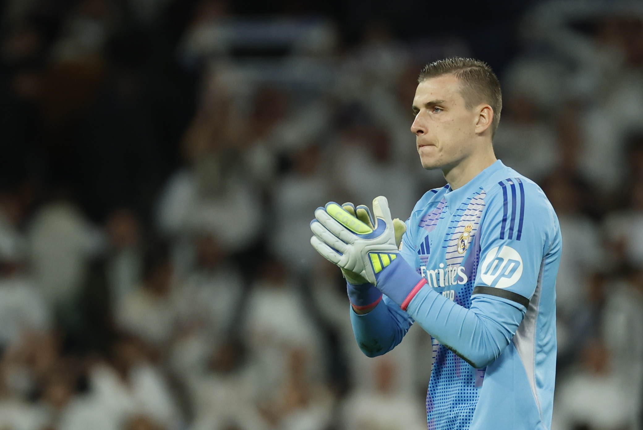 Lunin applauds the crowd at the Santiago Bernabeu.