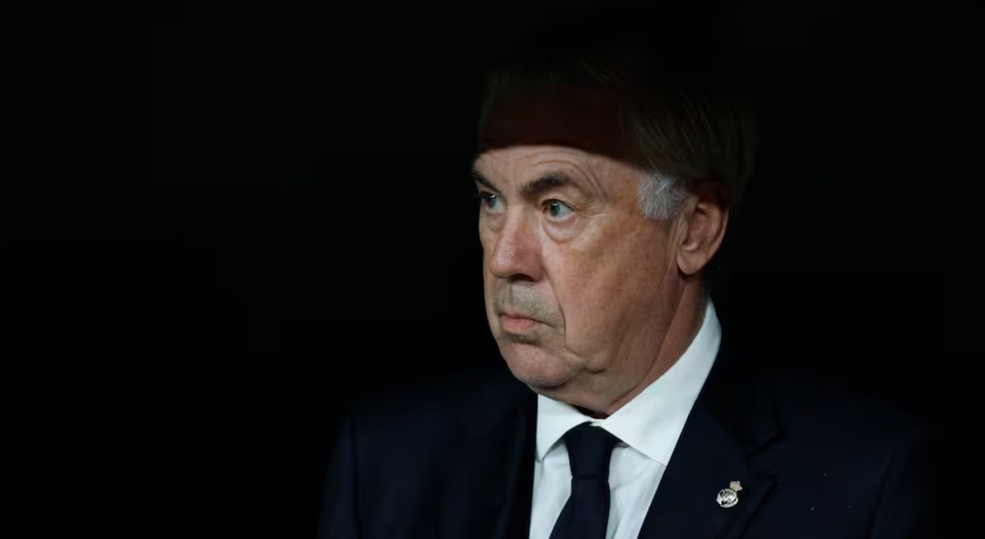 Ancelotti in shadow on the Real Madrid bench.