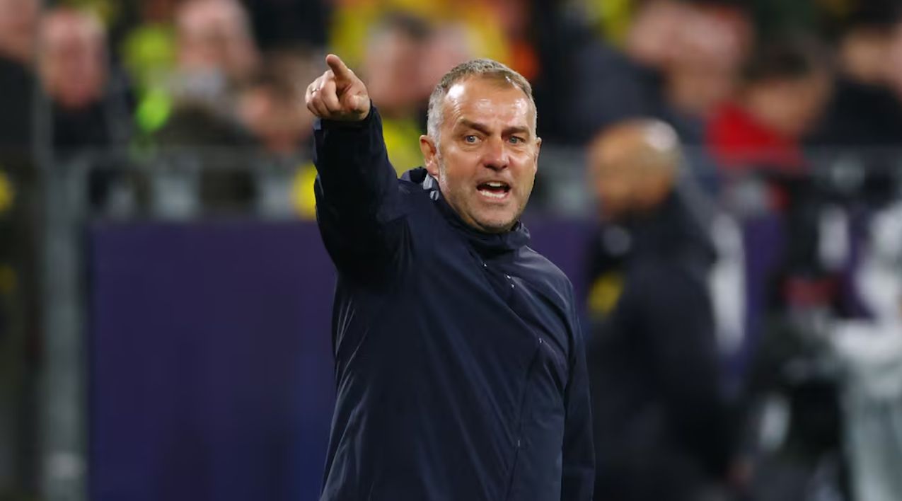 Flick gives instructions to Barcelona on the touchline.