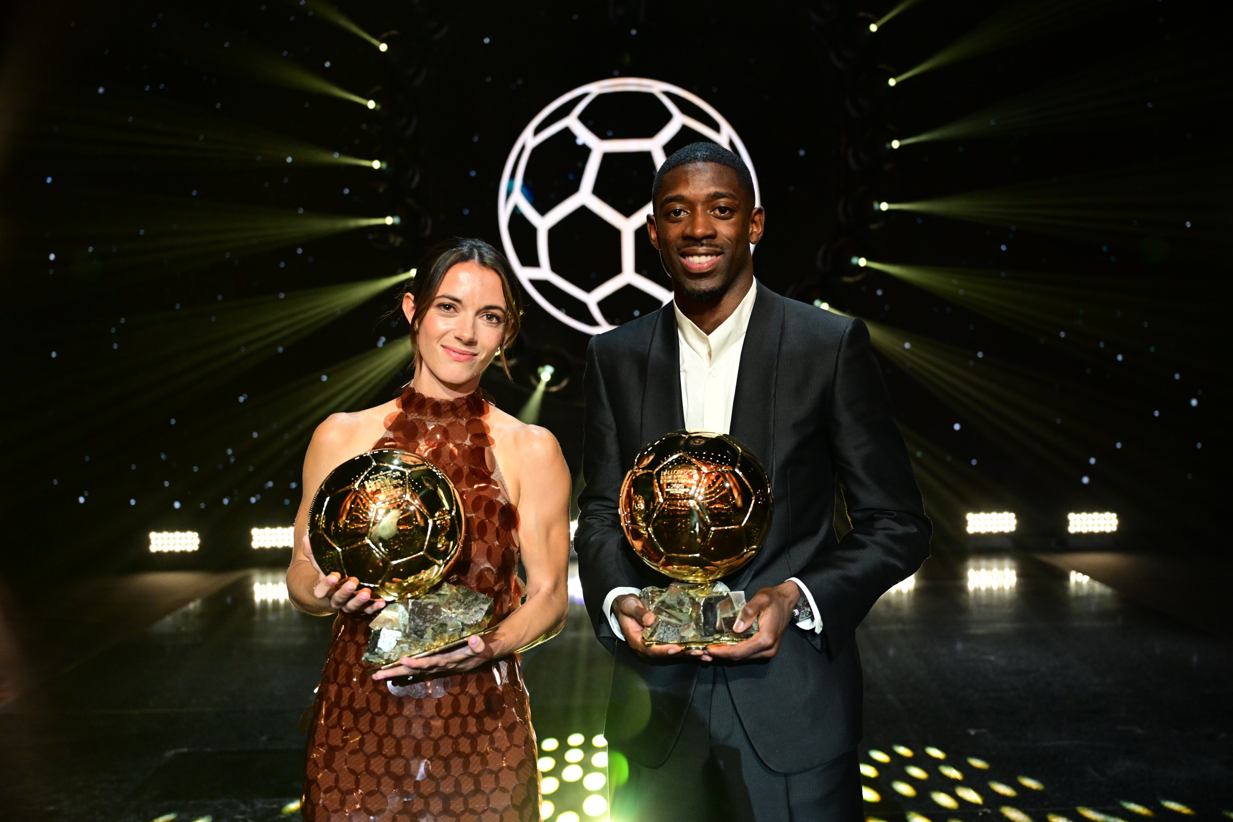 Ousmane Dembele and Aitana Bonmati pose with their awards.