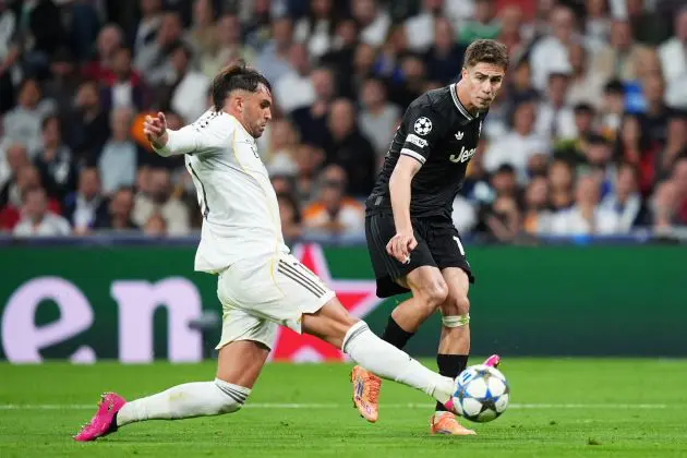Raul Asencio makes a tackle against Juventus.