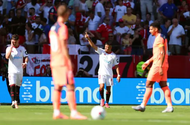 Alexis Sanchez celebrates against Barcelona.