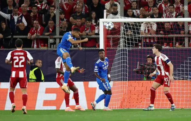 Mbappe rises to score against Olympiakos.