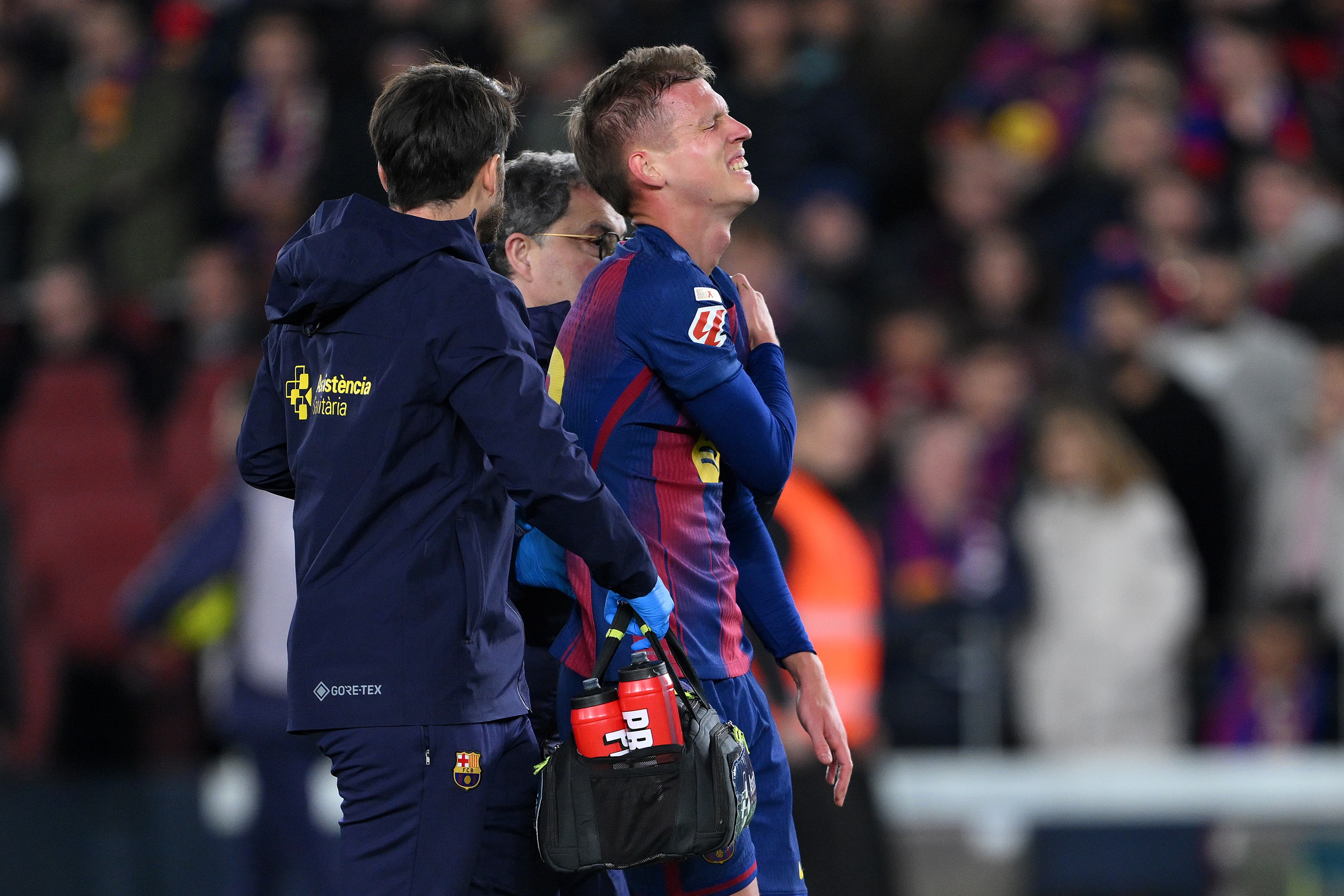 Olmo comes off injured against Atletico Madrid.