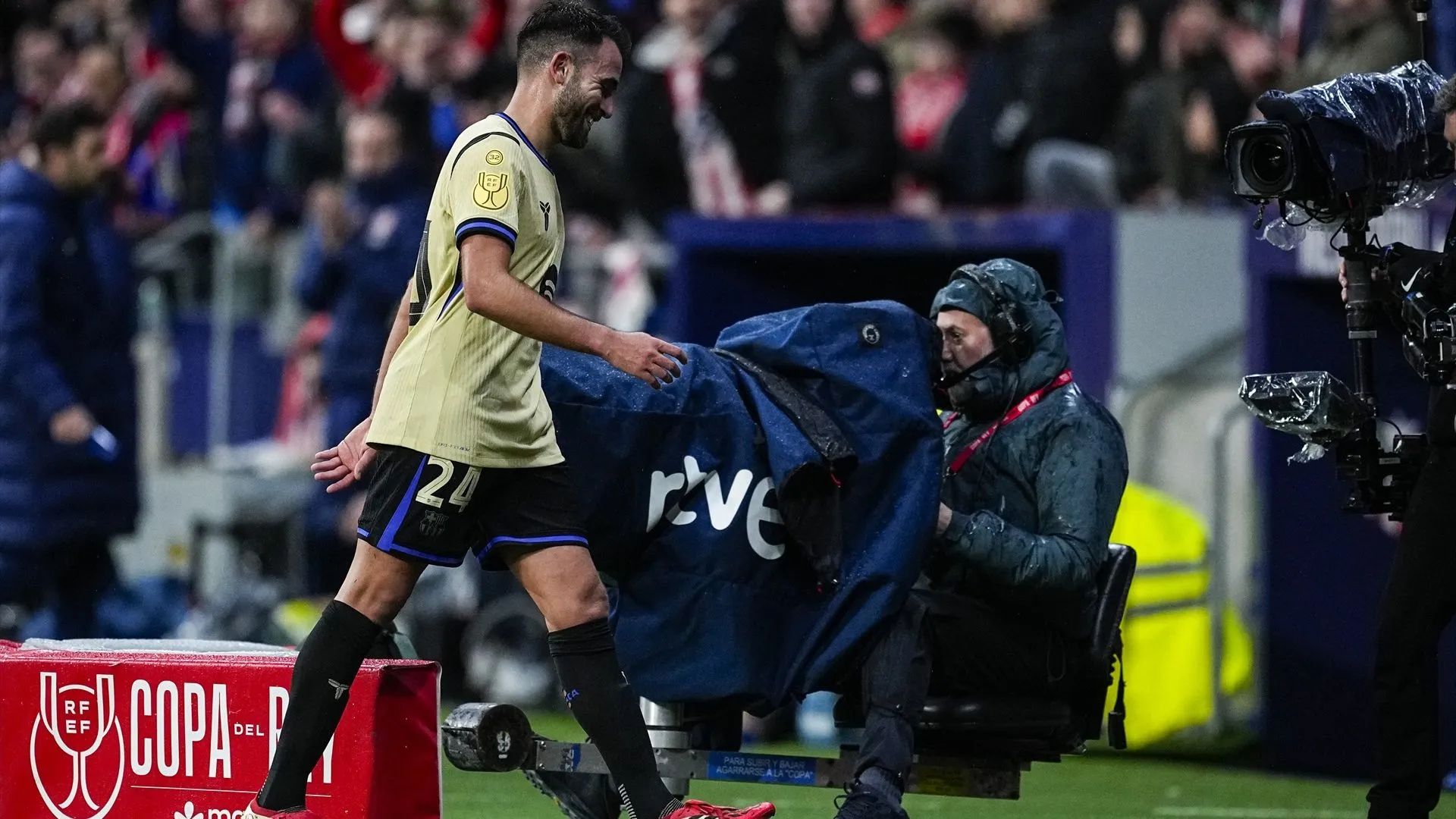 Garcia walks off after a red card.