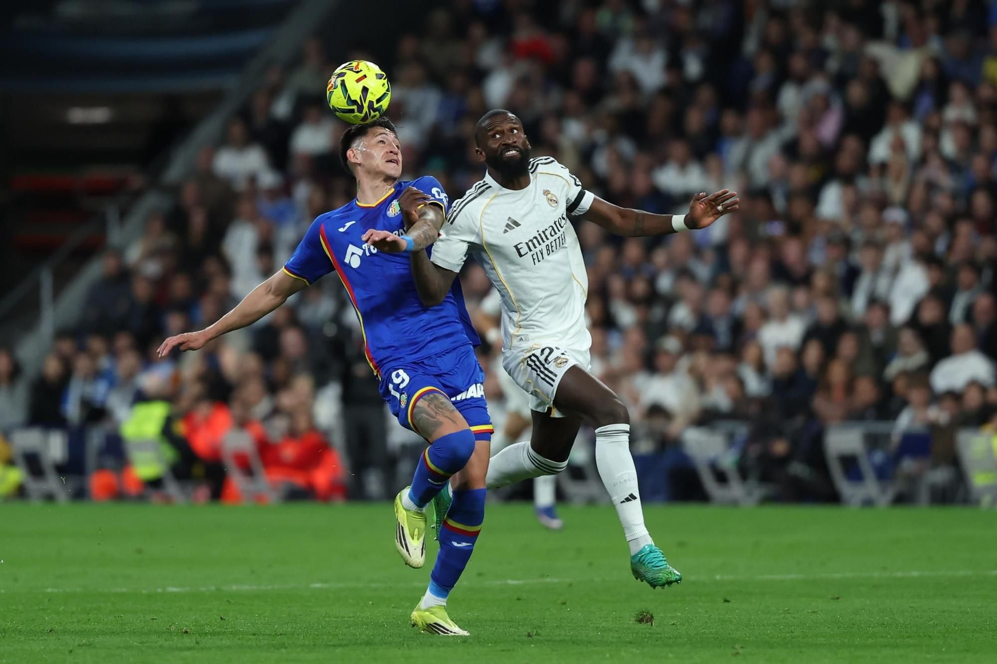 Rudiger competes for the ball against Luis Vazquez.
