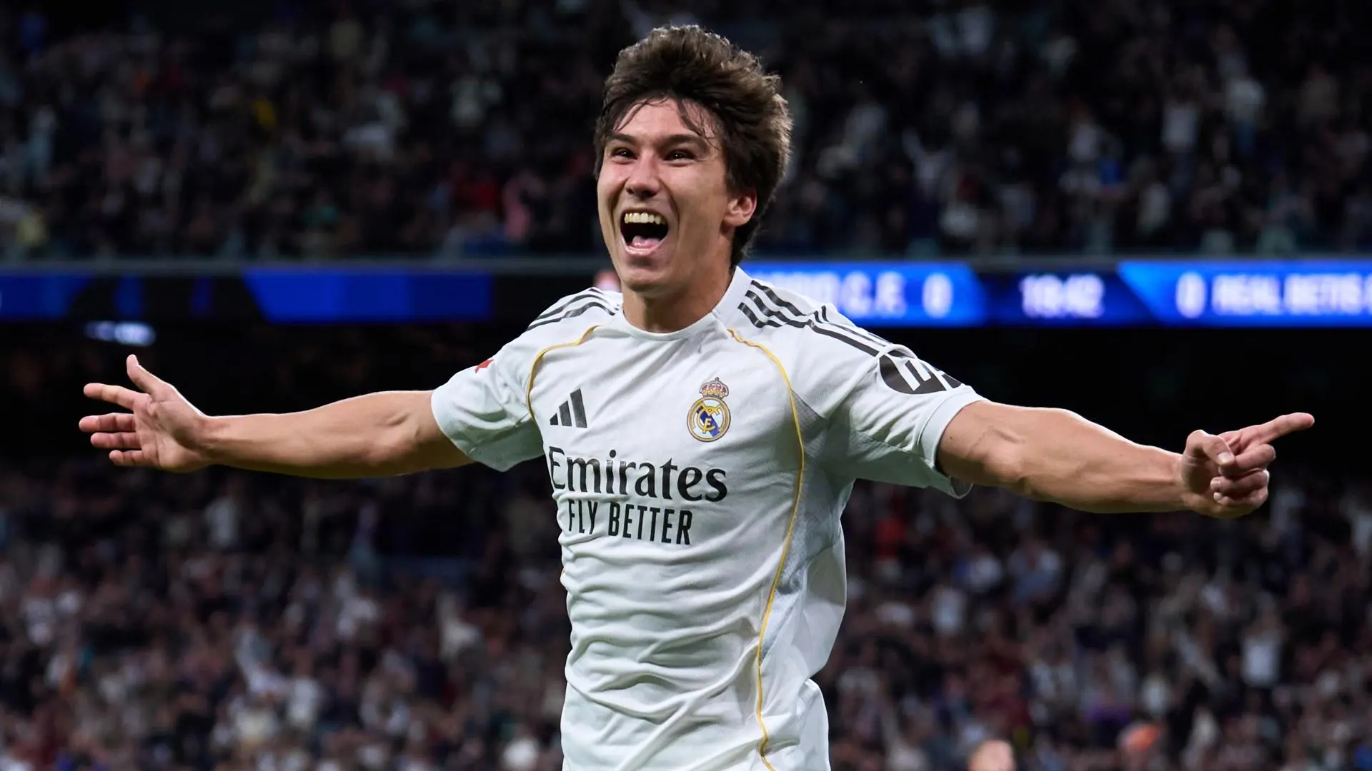 Gonzalo Garcia celebrating in a Real Madrid jersey during a match.