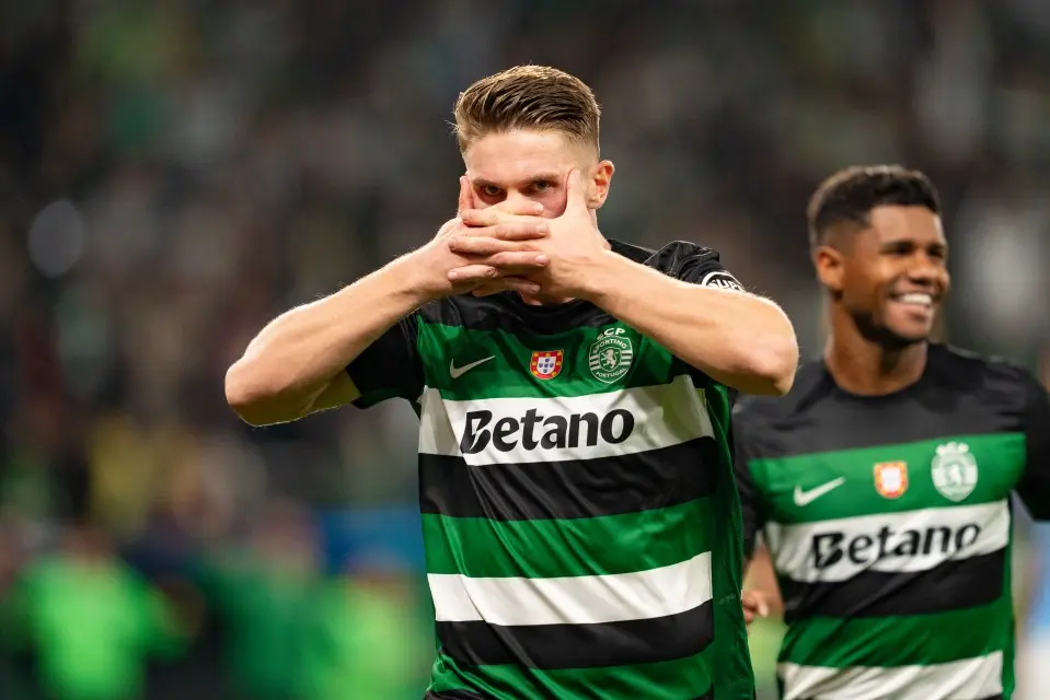 Viktor Gyokeres in a Sporting CP jersey performing his signature celebration with hands over his mouth
