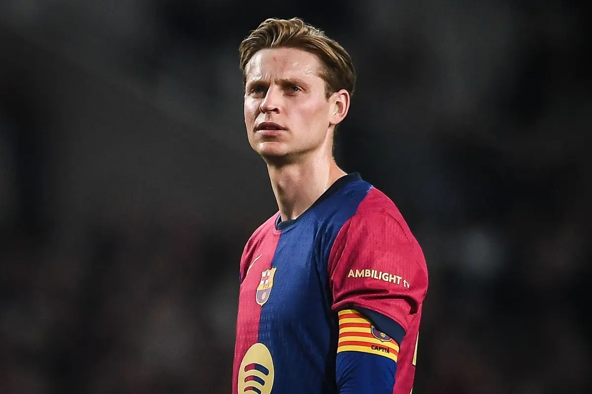 Frenkie de Jong wearing the FC Barcelona home kit and captain's armband