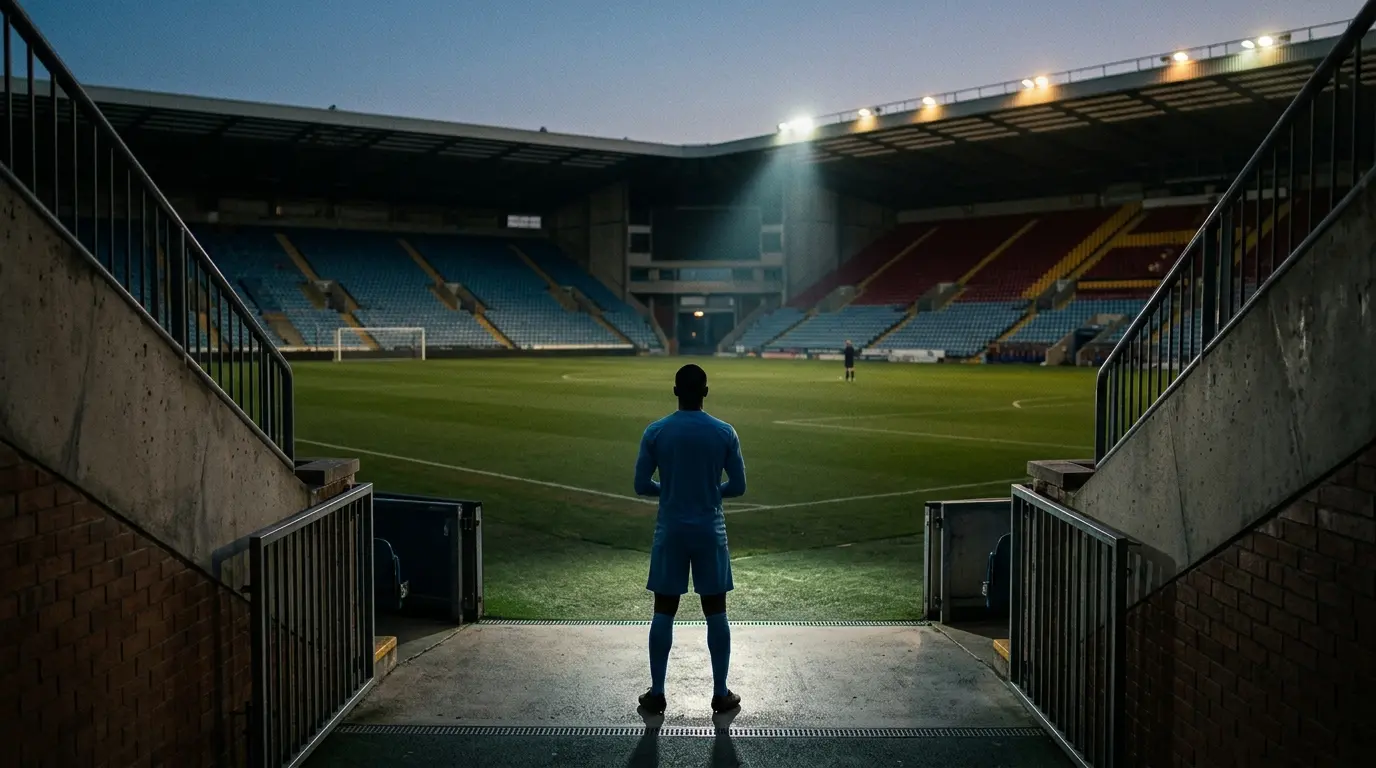 Silhouetted midfielder outside a floodlit stadium representing Bernardo Silva’s failed Barcelona transfer